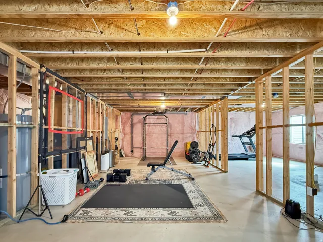 Workout area featuring finished concrete floors