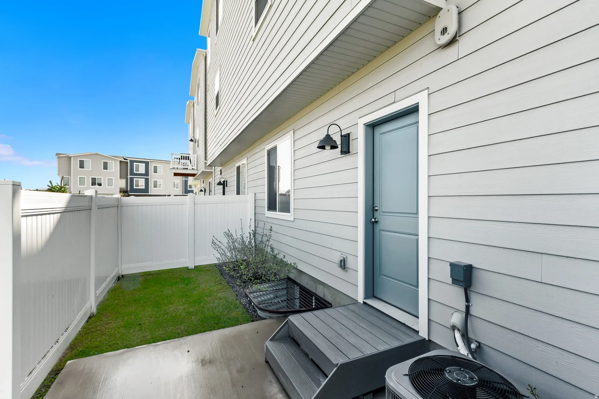 Fenced backyard with a patio area