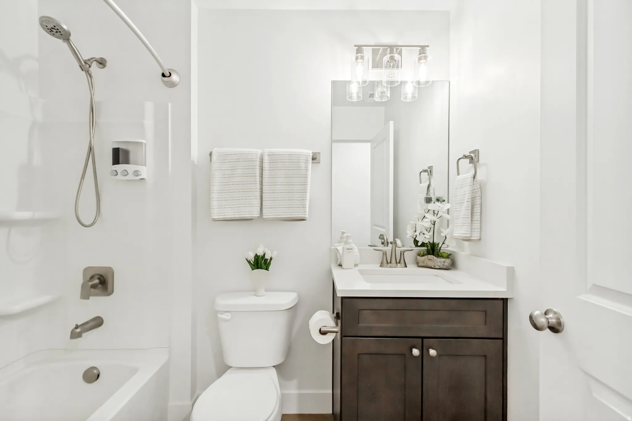 Bathroom with vanity and shower / bath combination