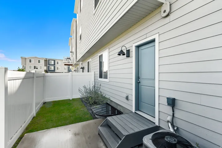 Fenced backyard with a patio area