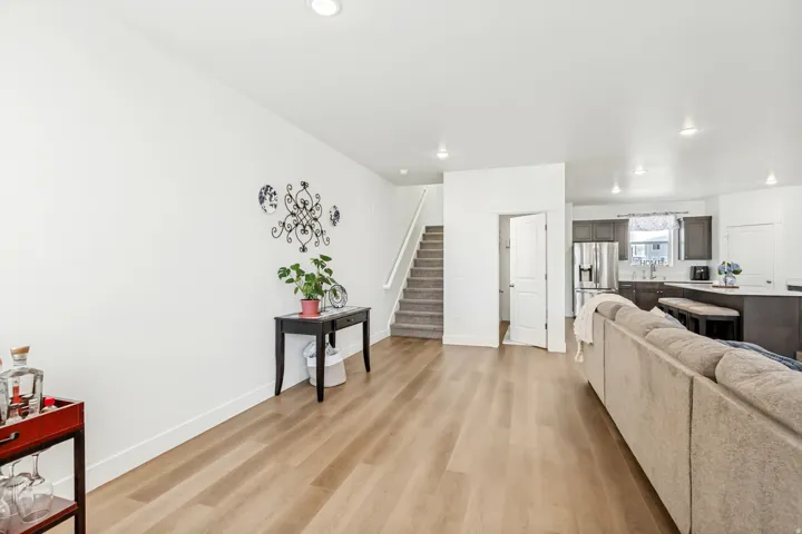 Living room featuring light wood-style flooring and recessed lighting