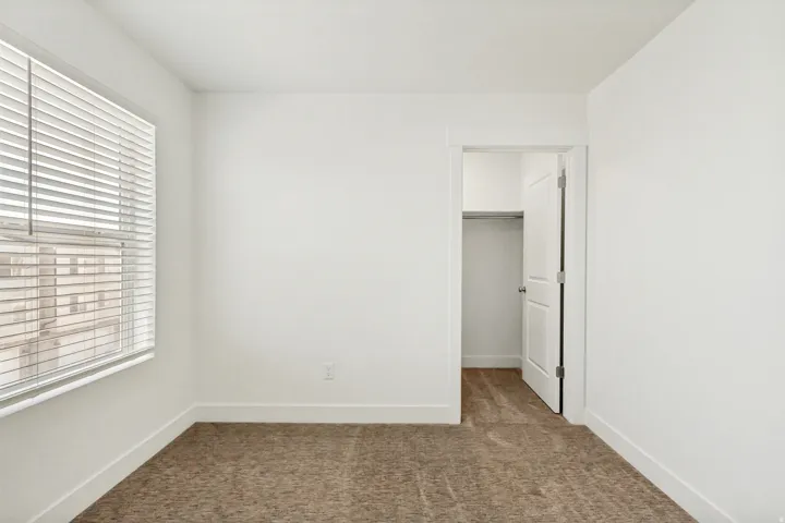 Bedroom featuring a spacious closet.