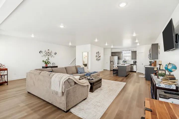 Living room featuring light wood-style floors and recessed lighting