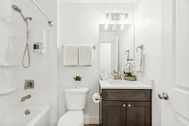 Bathroom with vanity and shower / bath combination