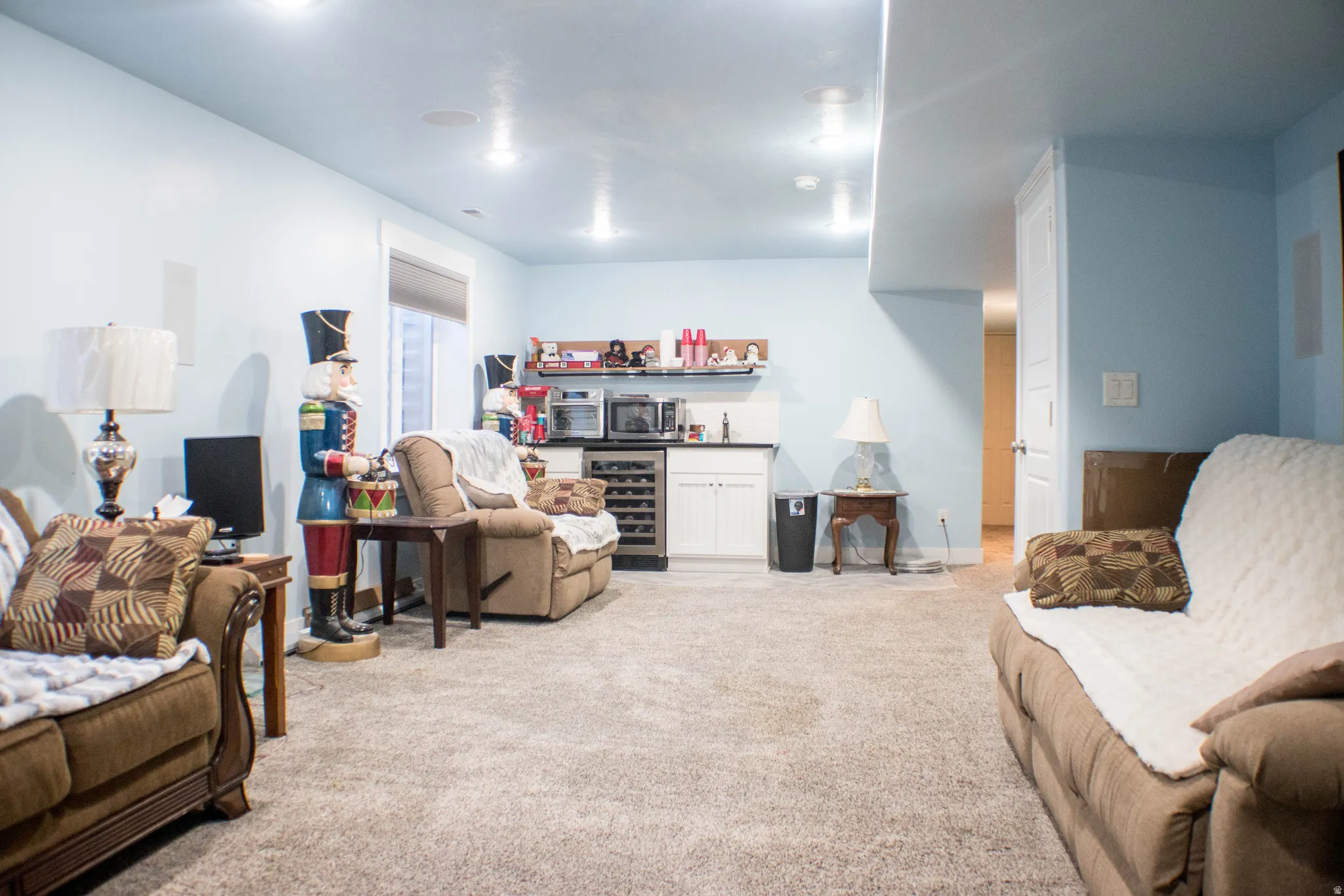 Spacious carpeted room featuring recessed lighting and light blue walls