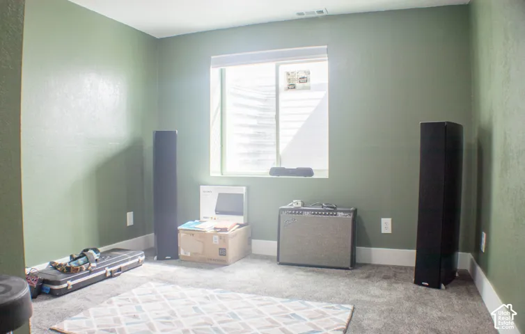 Bedroom with light carpet