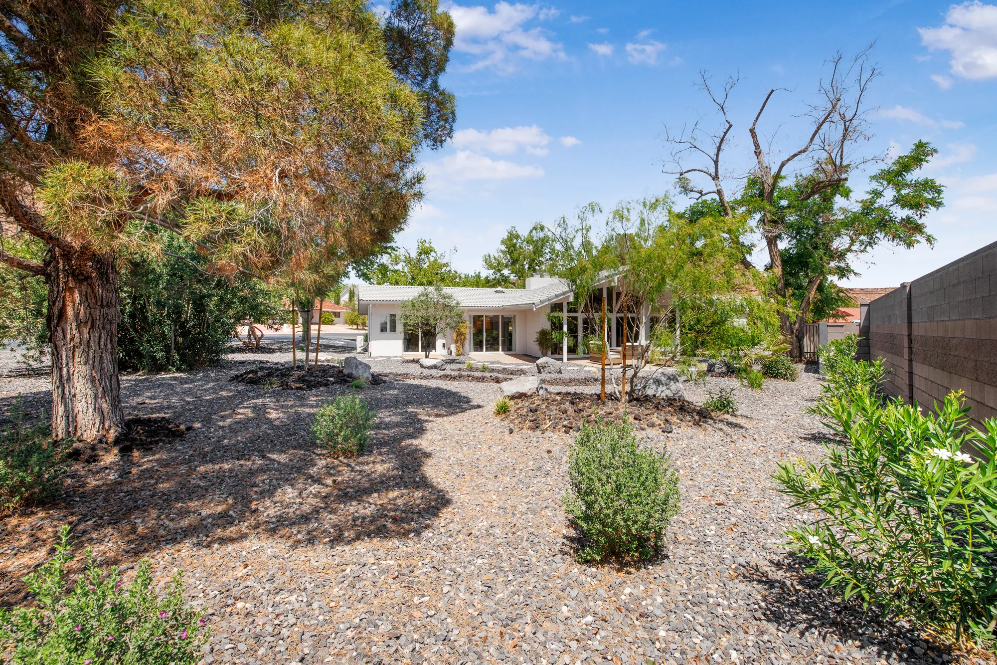 Back of house with a patio area and a fenced backyard