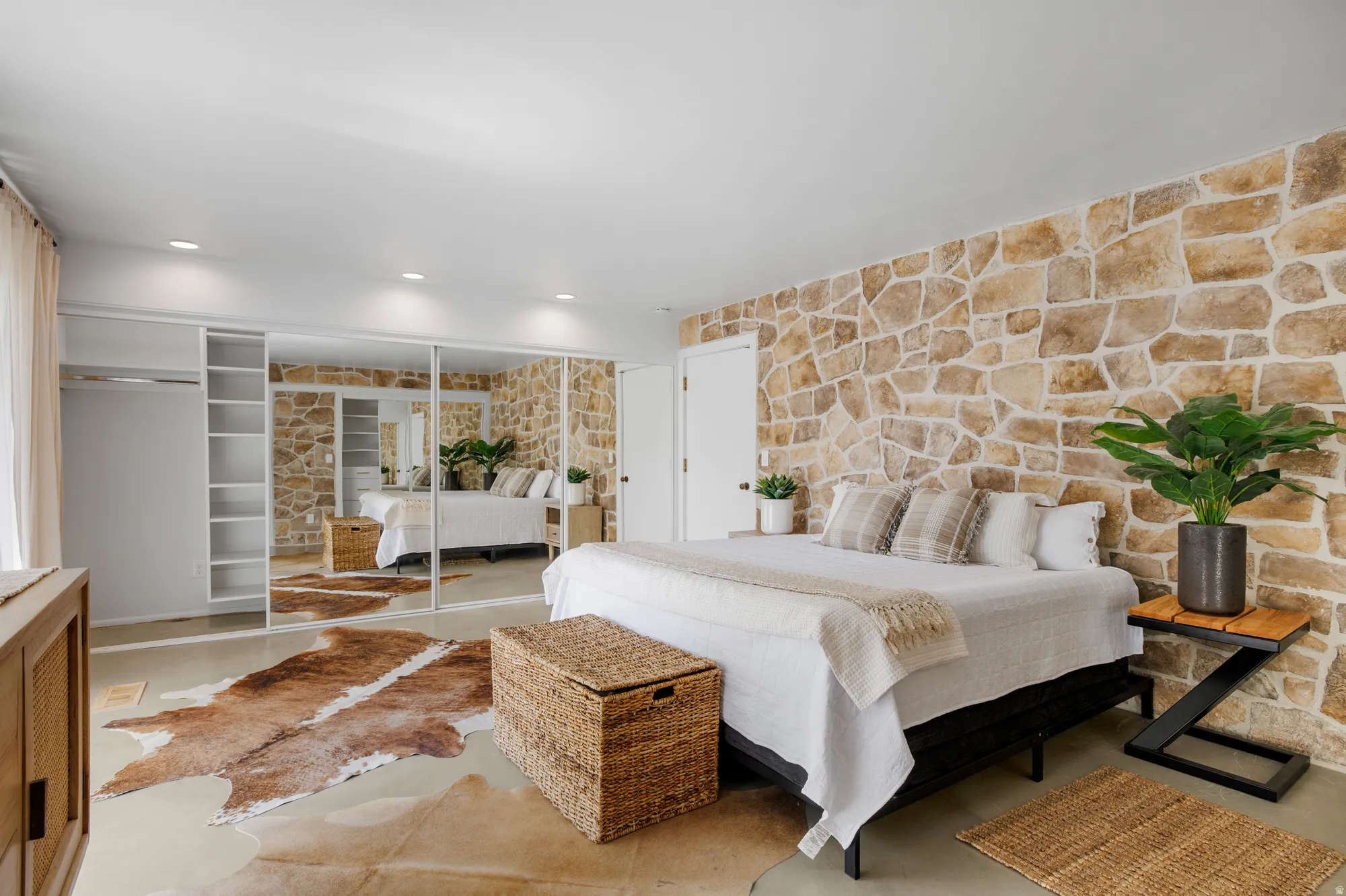 Bedroom featuring a closet, recessed lighting, and concrete floors
