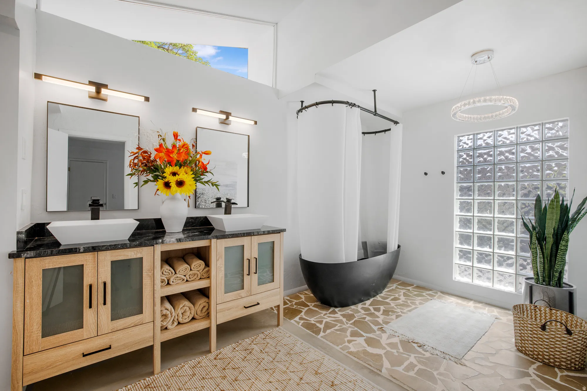 Full bath with double vanity and a freestanding bath