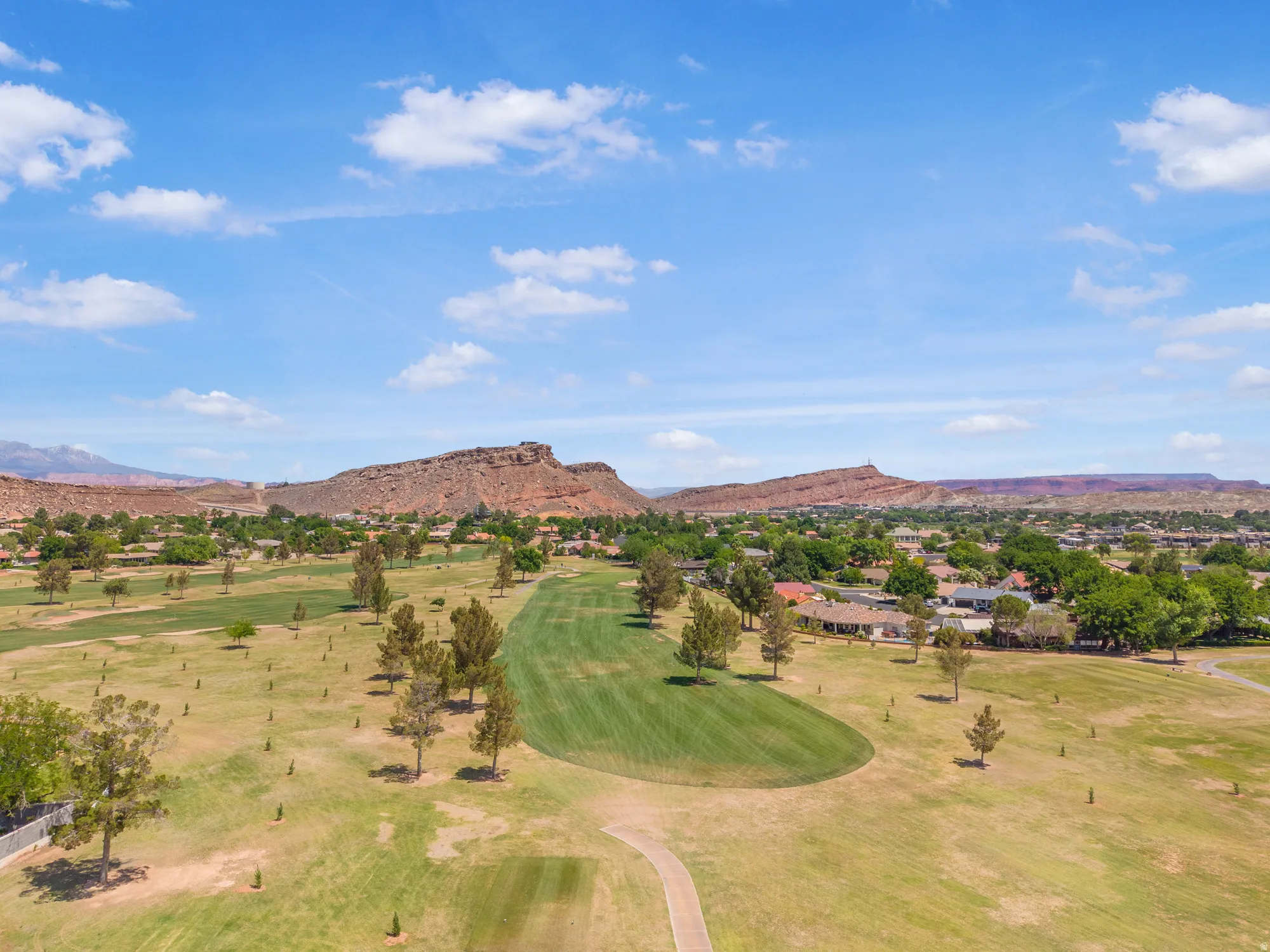 Mountain view with a local golf course and nearby suburban area
