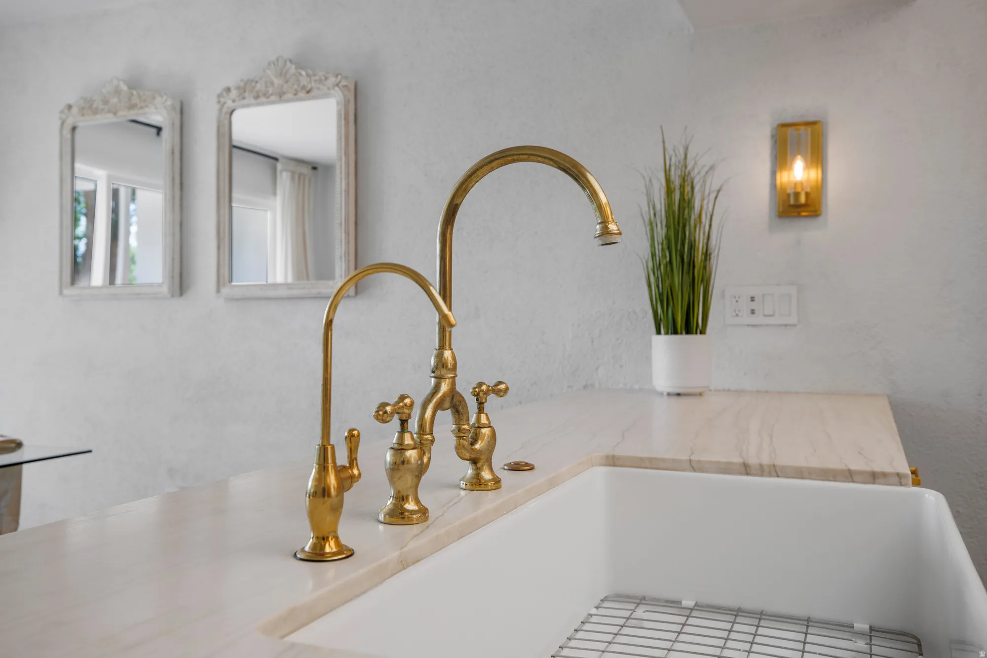 Kitchen view of a textured wall and light countertops