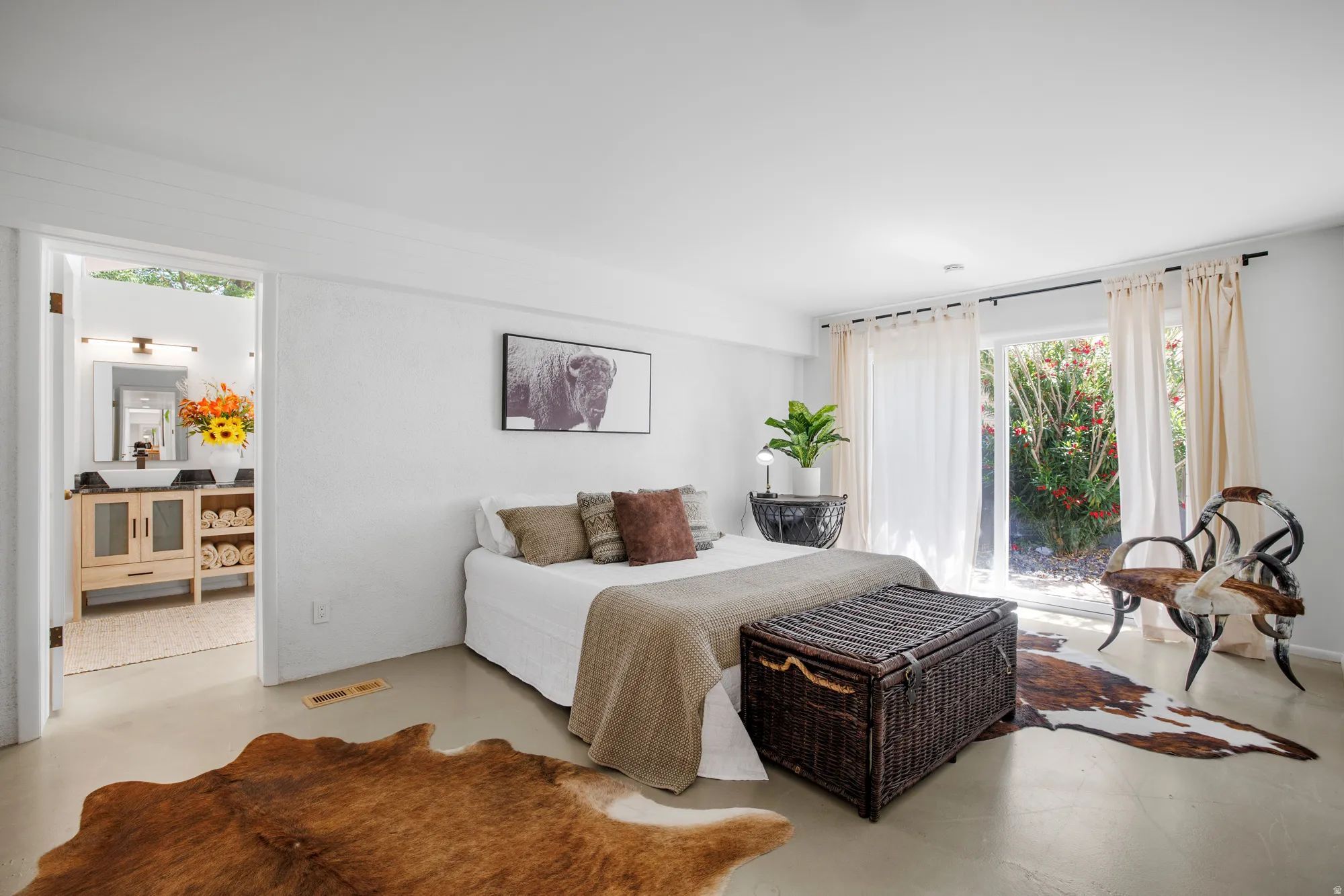 Bedroom with concrete flooring