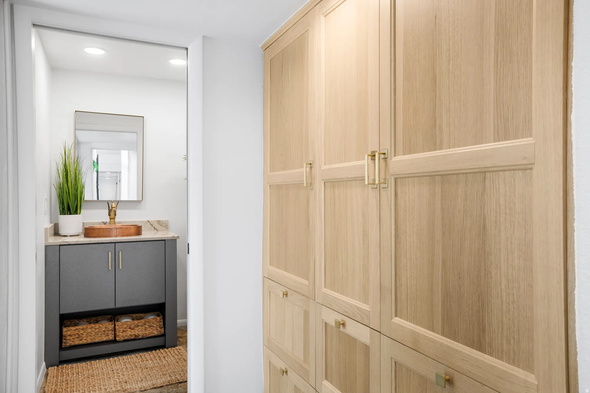 Bathroom featuring vanity and recessed lighting