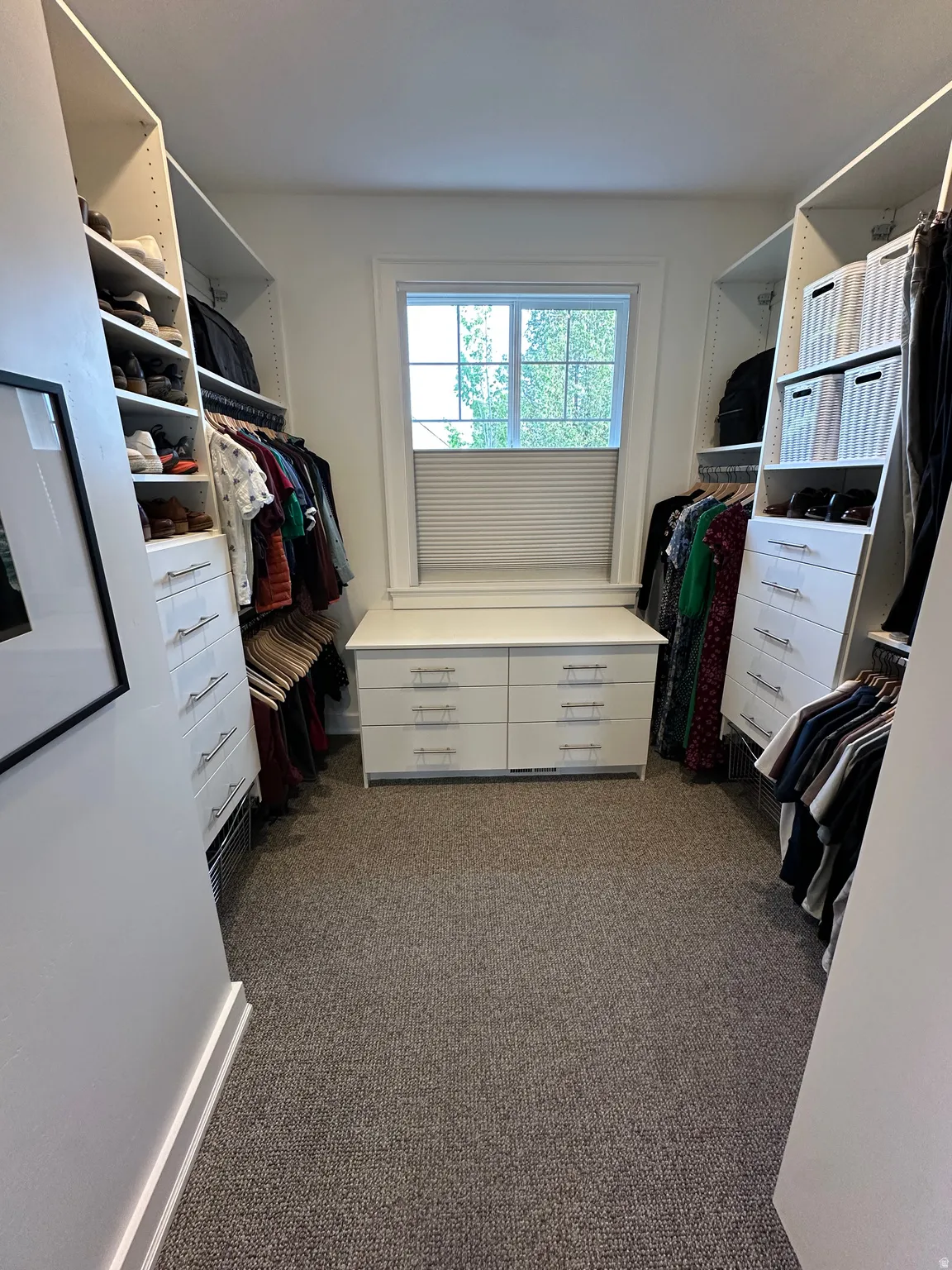 Master Walk in closet featuring dark carpet