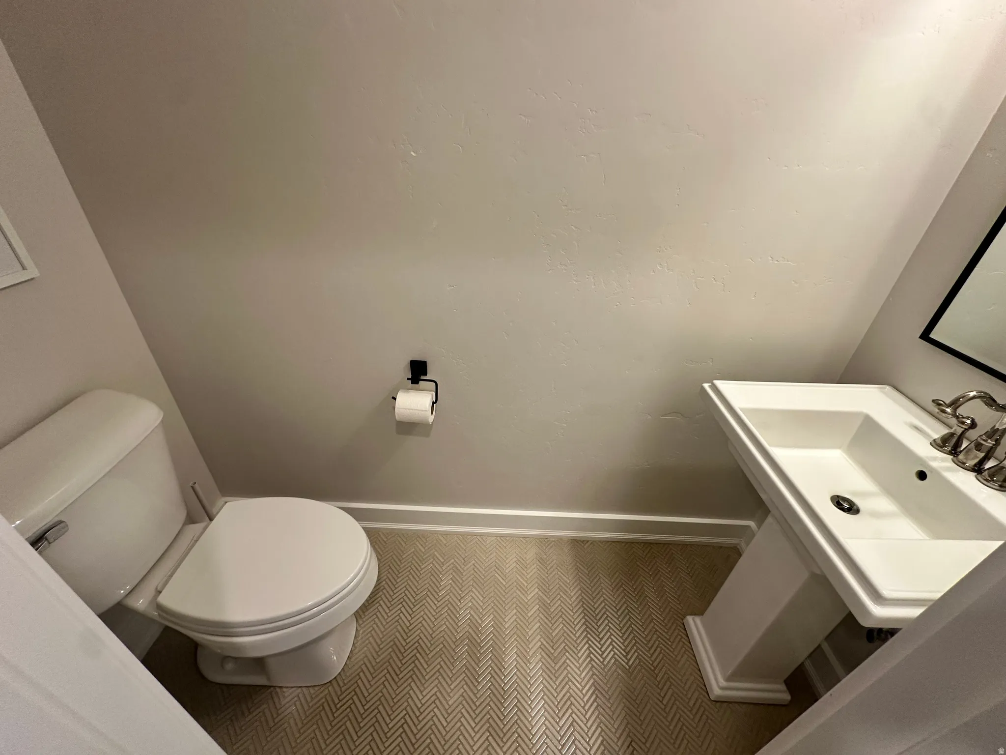 Half Bathroom featuring toilet and tile patterned floors