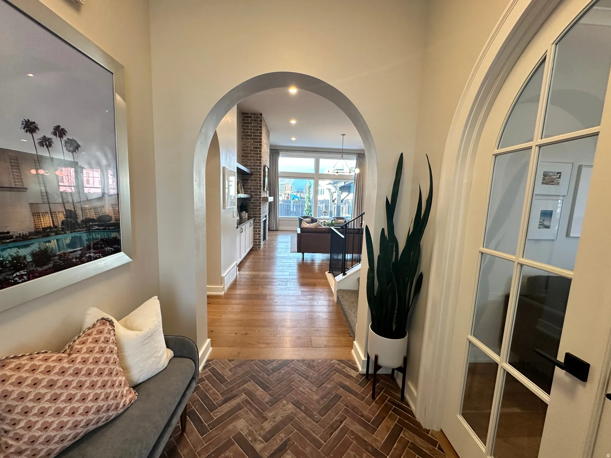 Hall with recessed lighting and arched walkways