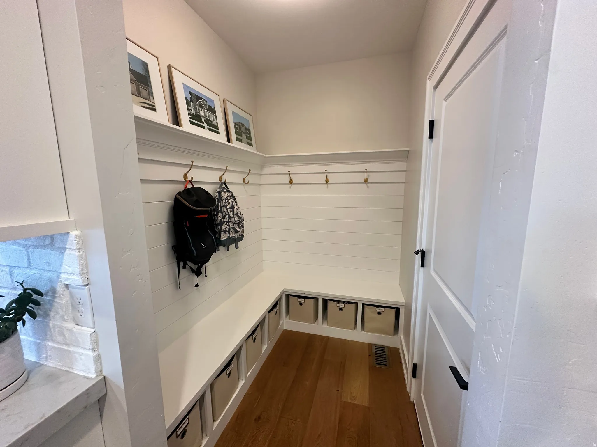 Mudroom featuring dark wood-style flooring