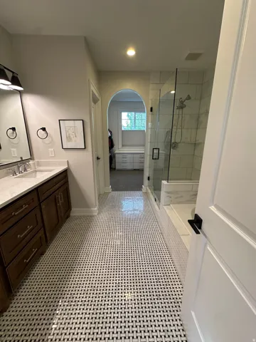 Master bath with vanity and a shower stall