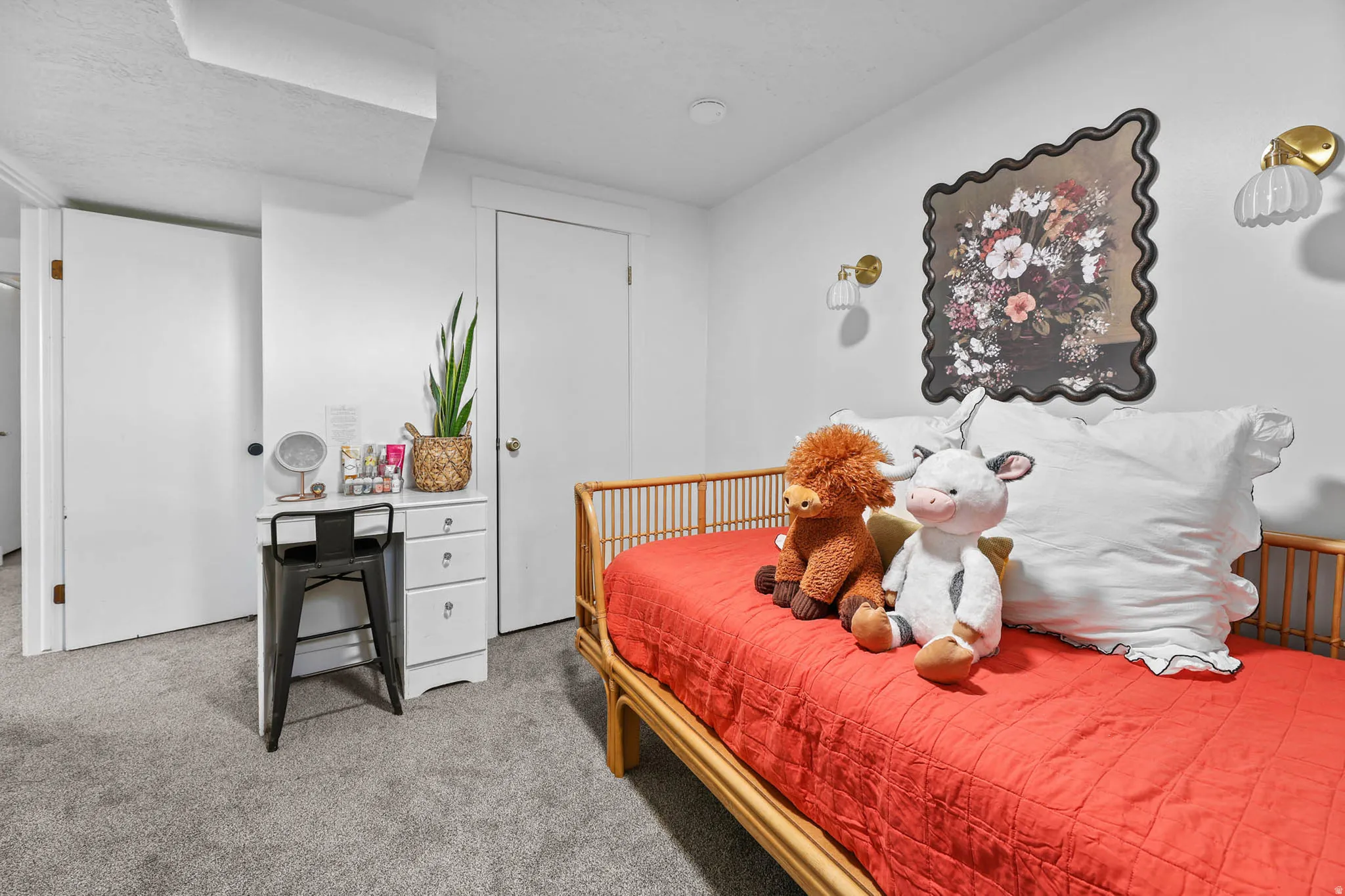 Bedroom featuring light carpet