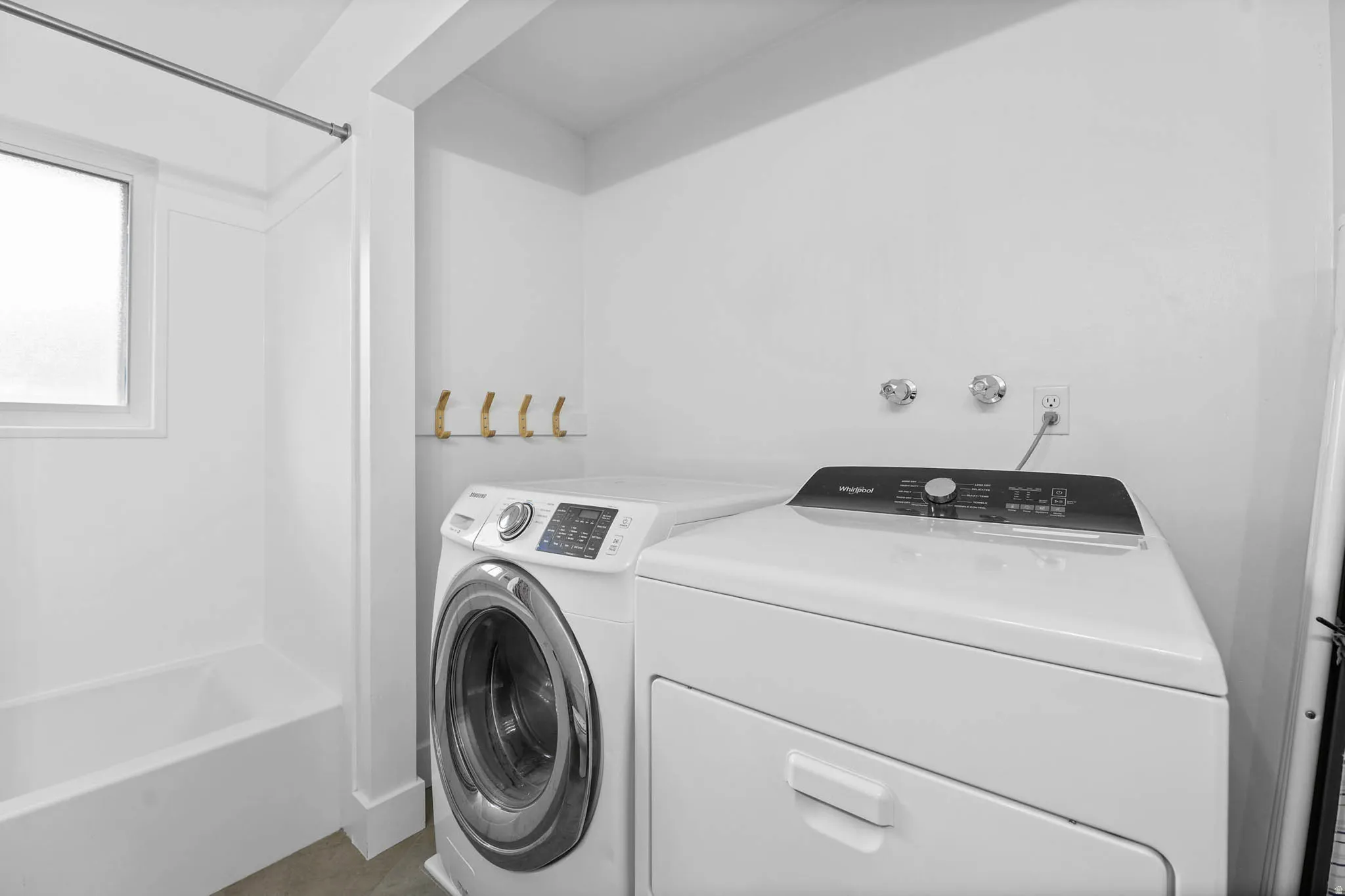 Laundry area featuring washer and clothes dryer