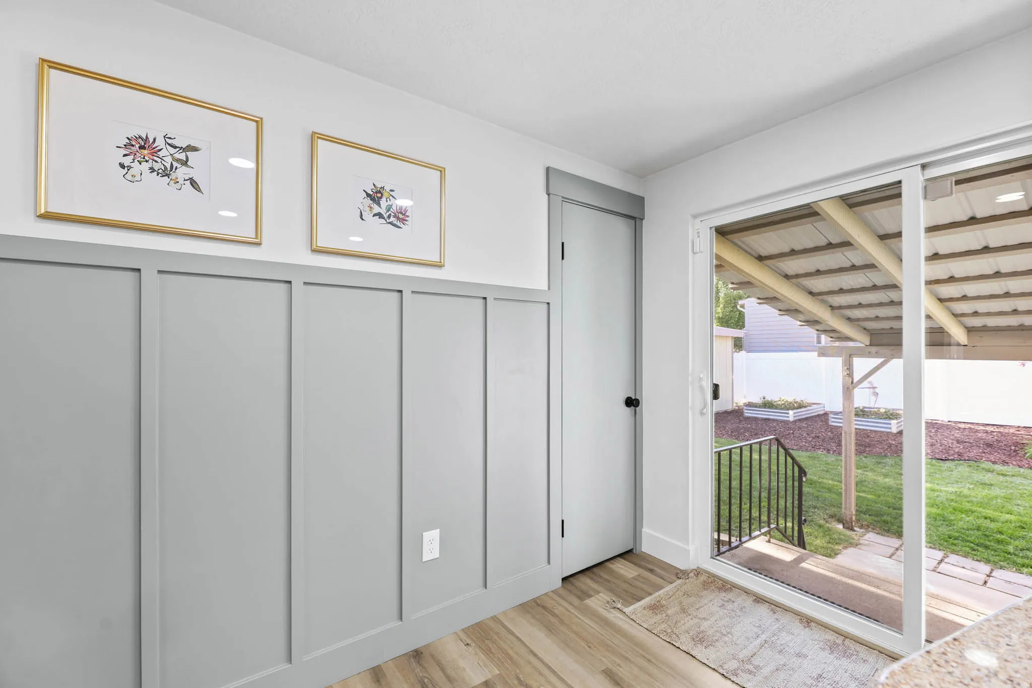 Entryway with a decorative wall and wood finished floors