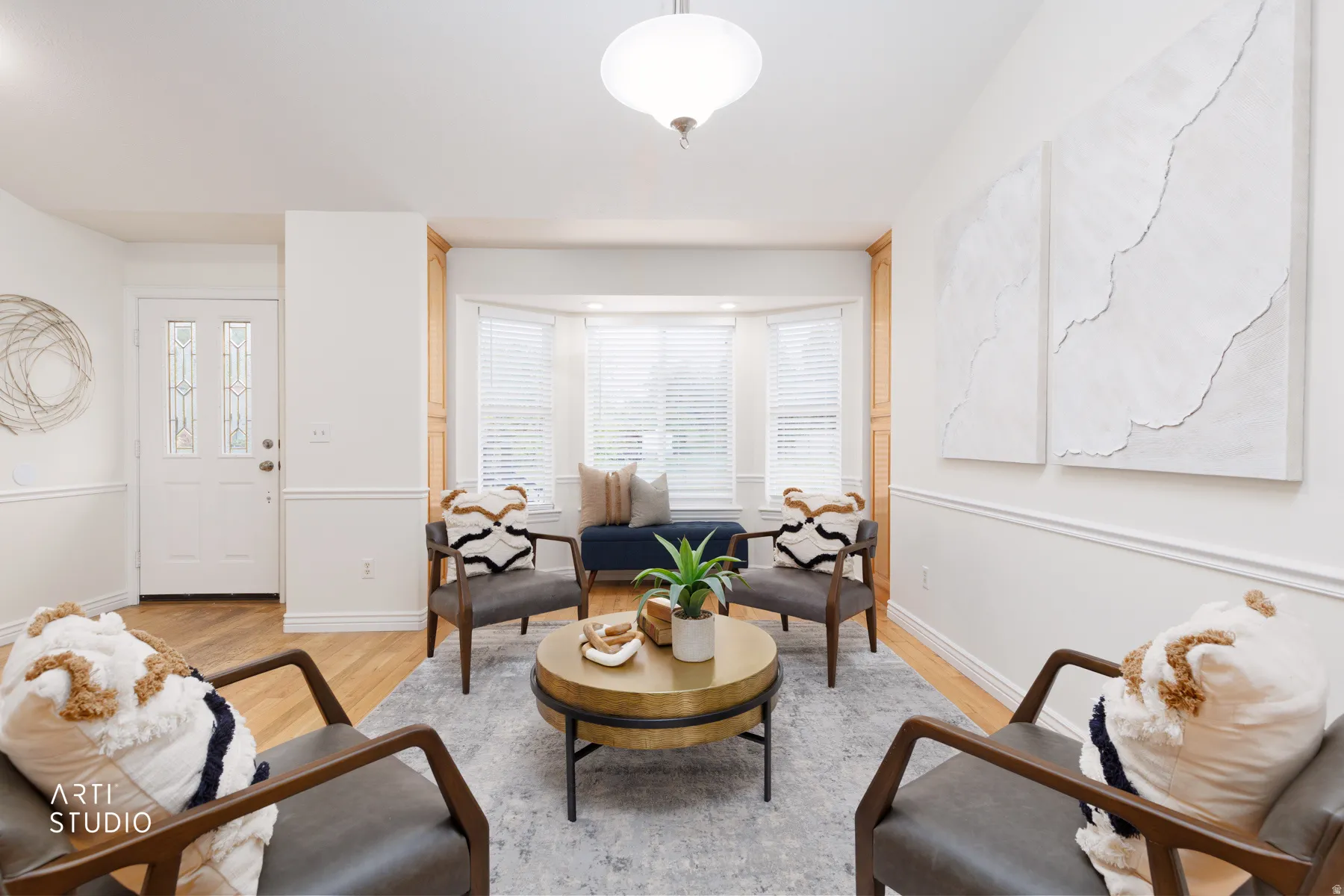 Living room featuring light wood-style flooring and baseboards