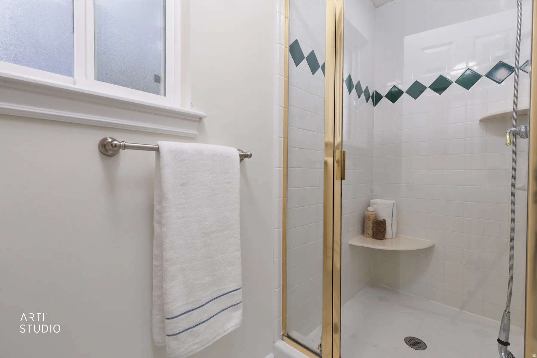 Bathroom featuring a shower stall