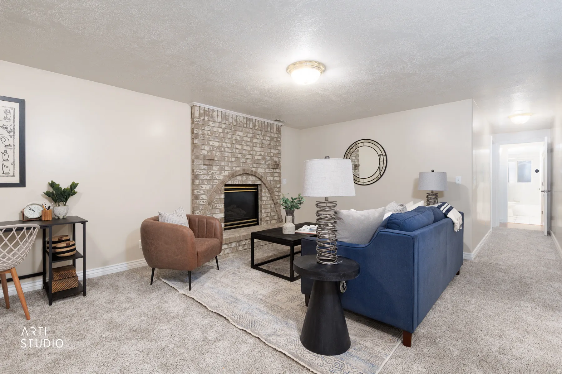 Living room with light carpet, a fireplace, and a textured ceiling