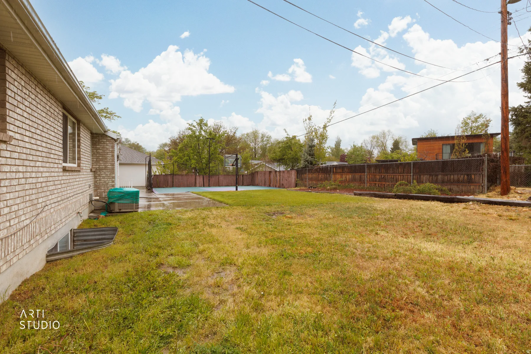 Fenced backyard featuring a patio area