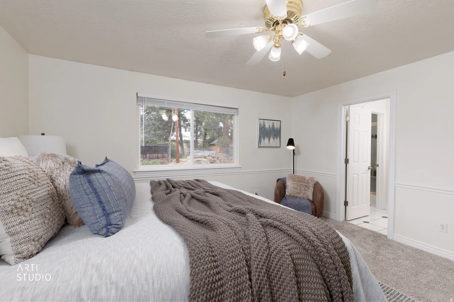 Bedroom featuring carpet, a textured ceiling, and ceiling fan