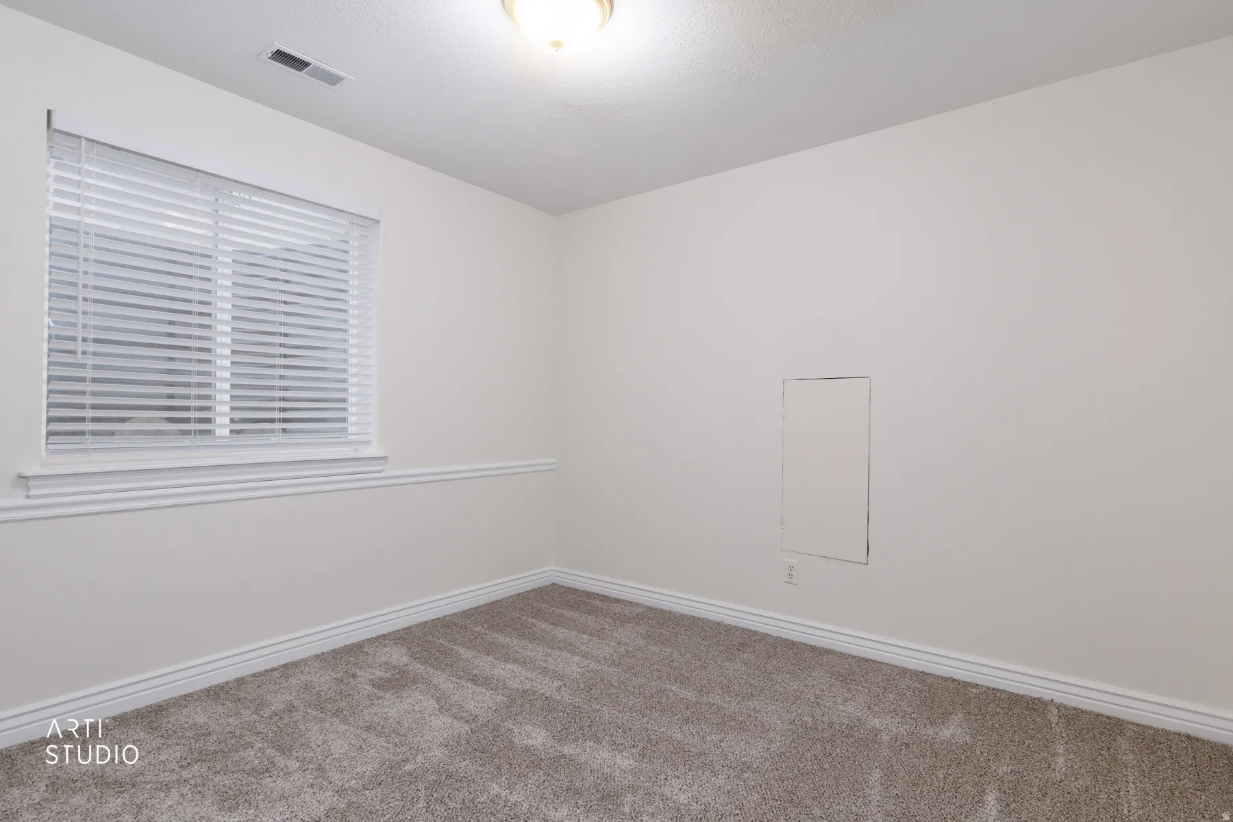 Unfurnished room featuring carpet flooring and baseboards