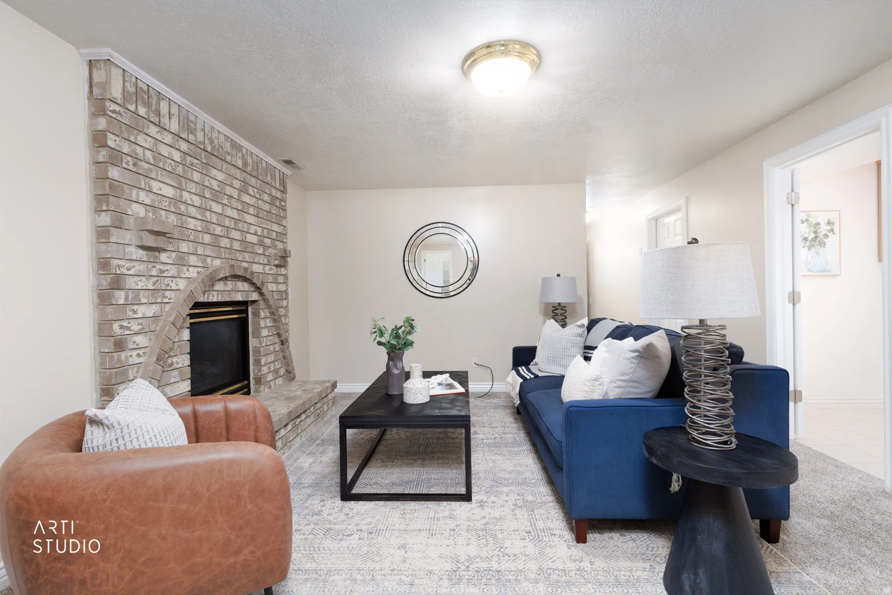 Living area featuring a fireplace and a textured ceiling