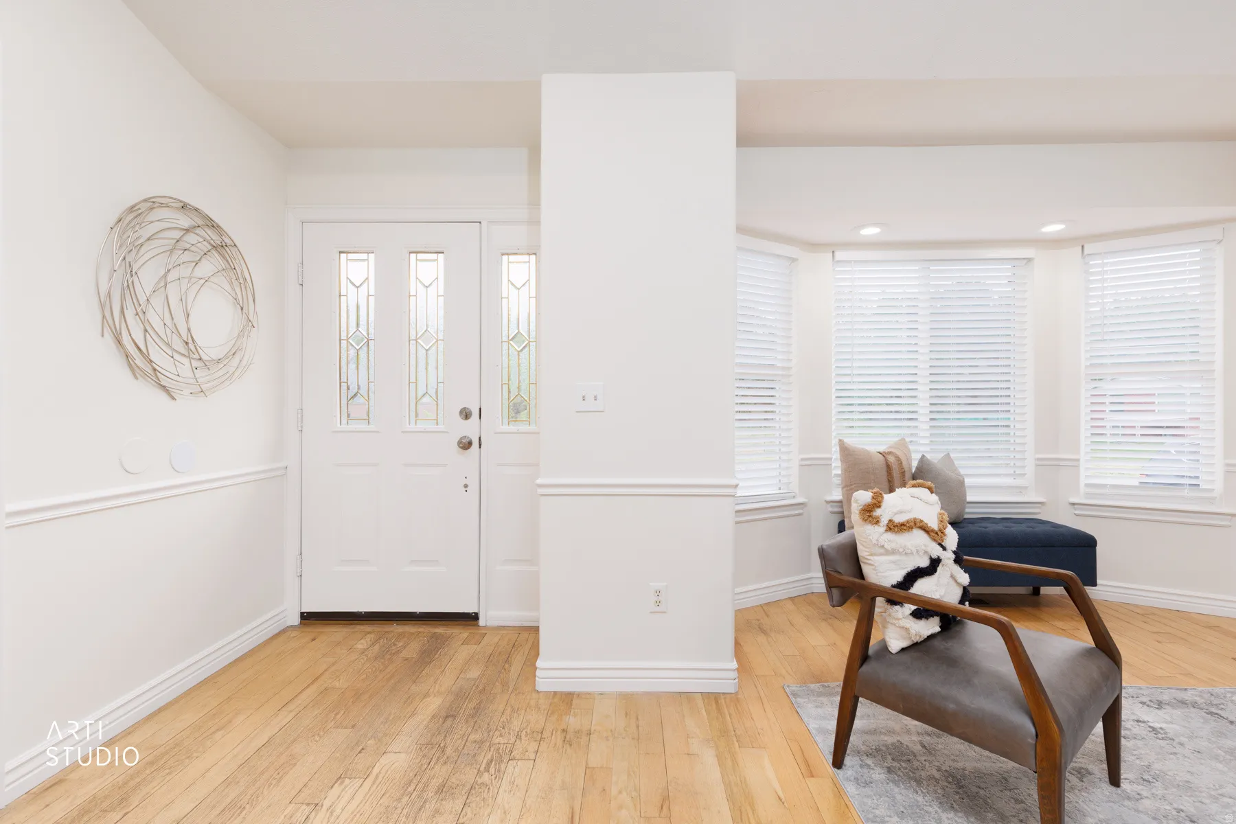 Foyer featuring light wood-style flooring and baseboards