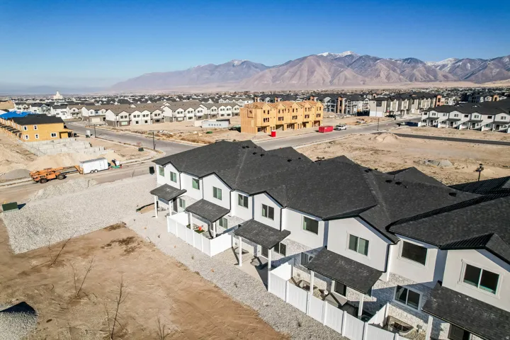 Aerial perspective of suburban area with a mountain backdrop