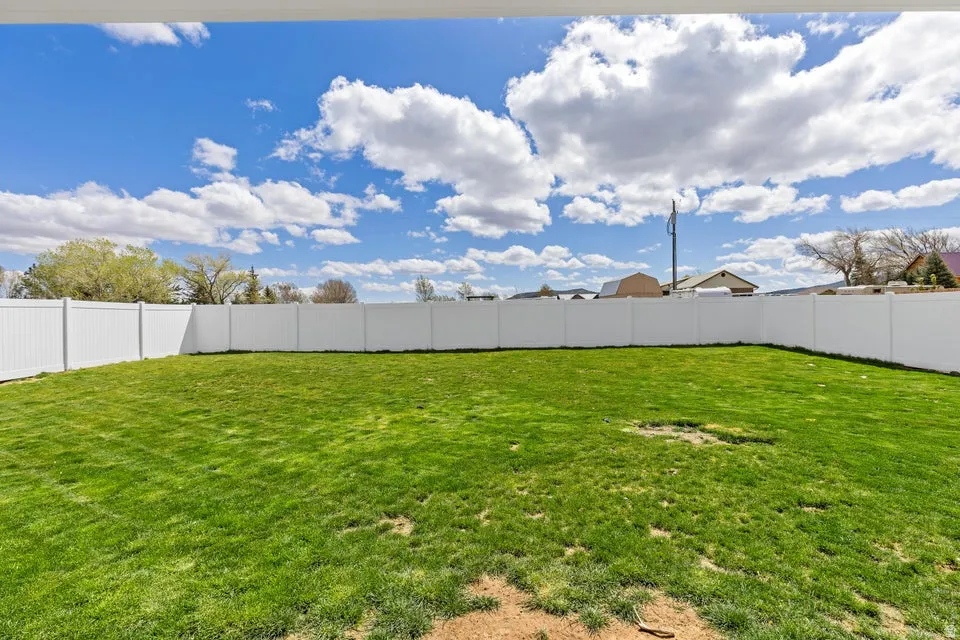 View of fenced backyard