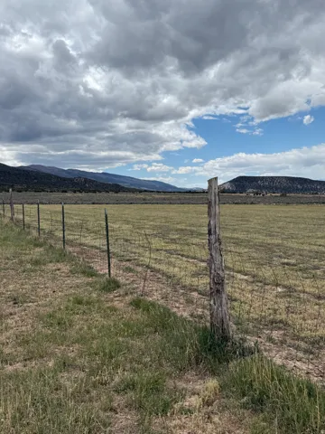 View of yard featuring a mountain view and a rural view