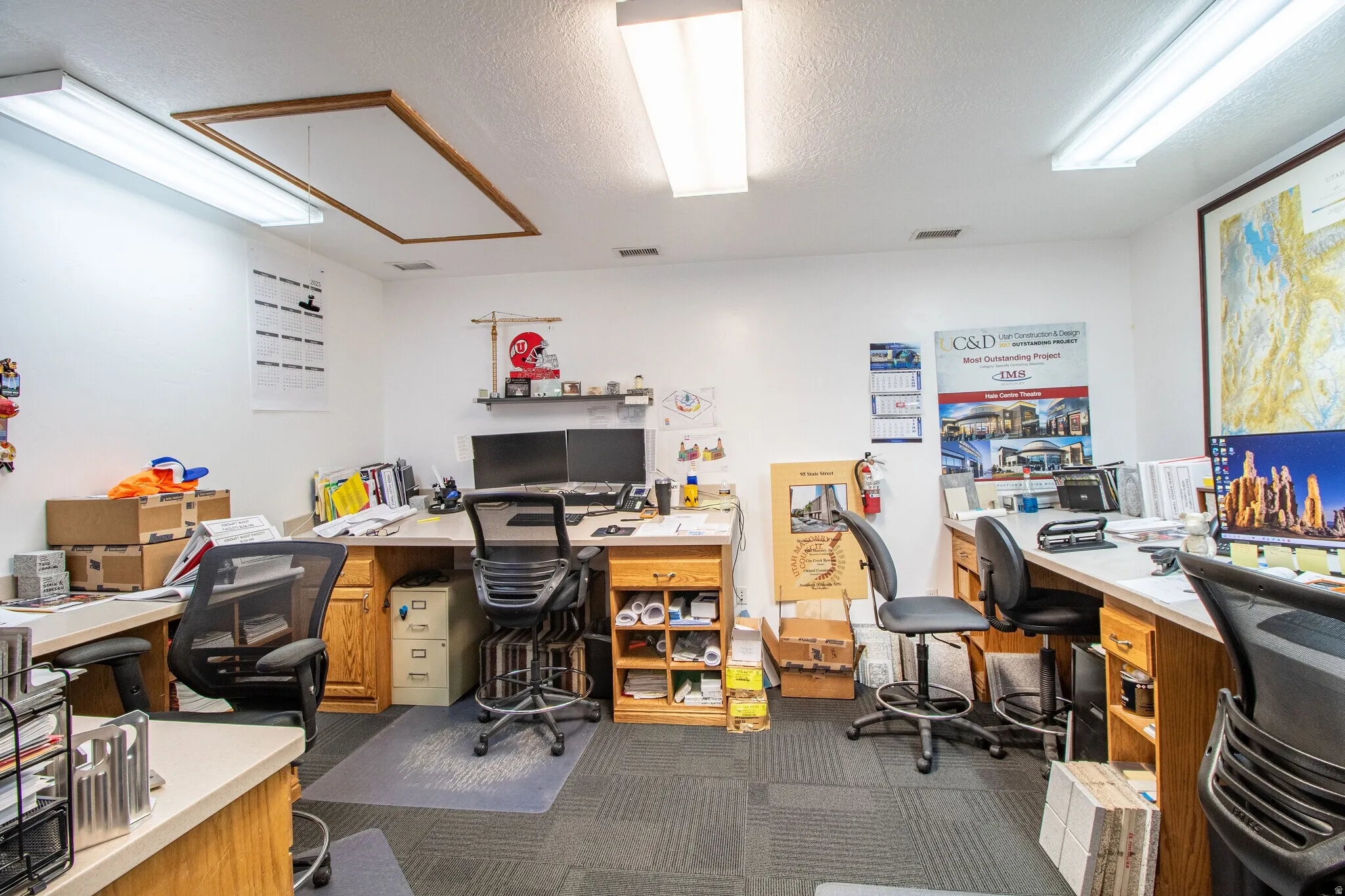 Office with a textured ceiling and built in desk