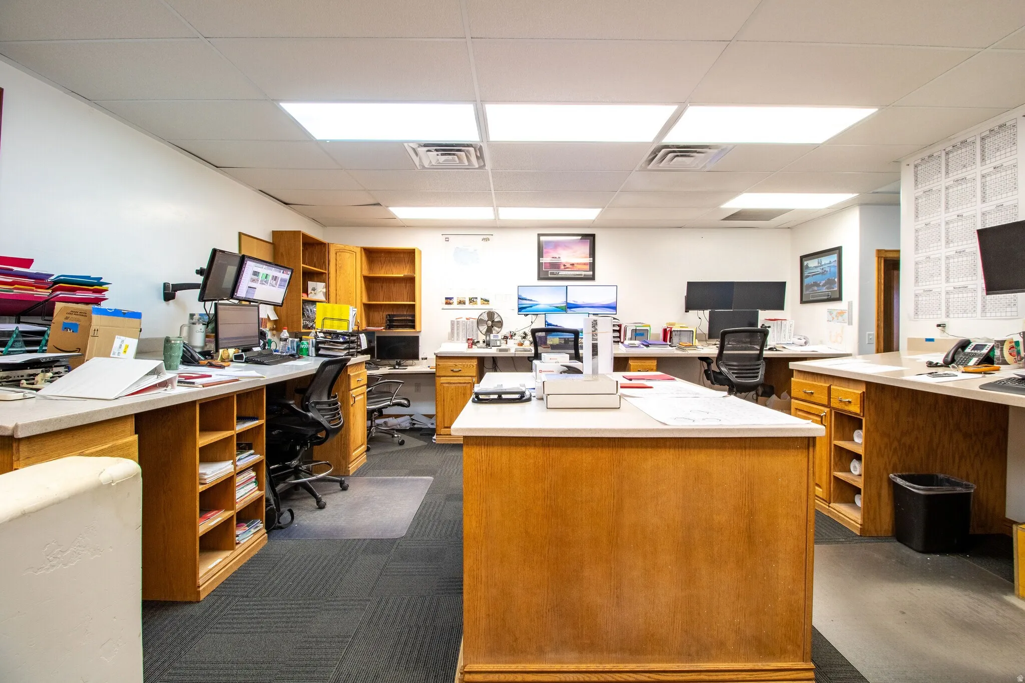 Home office featuring a drop ceiling