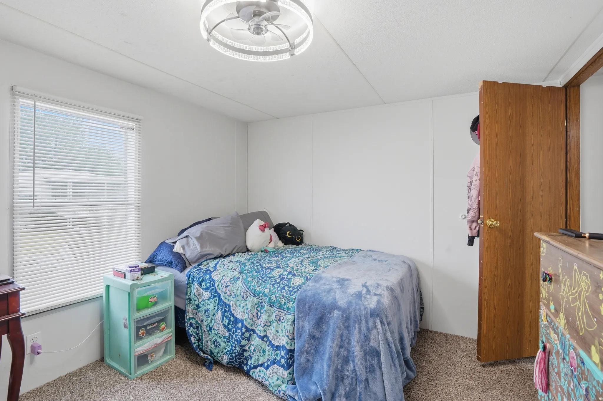 Bedroom with light carpet
