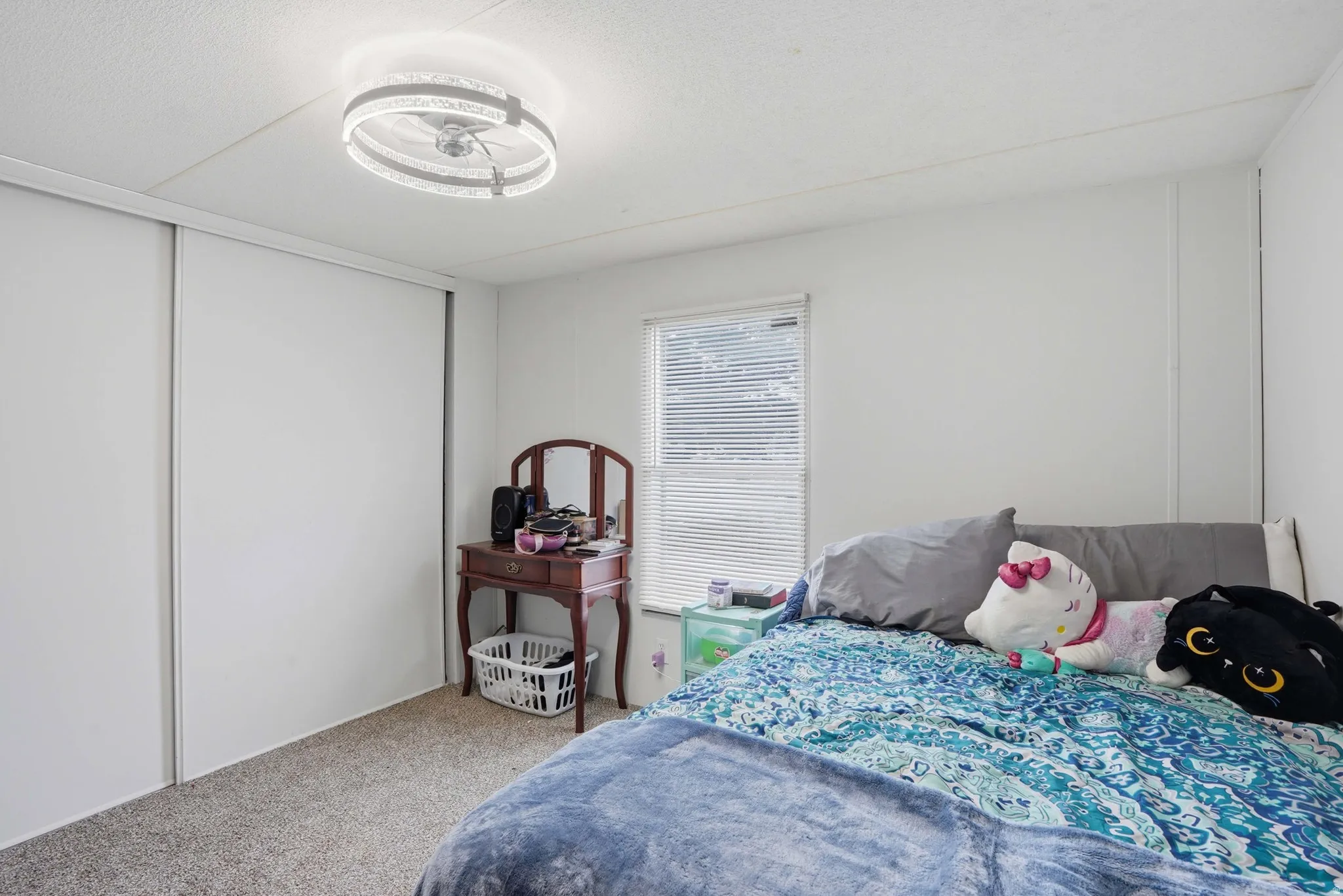 Bedroom with carpet floors and a closet