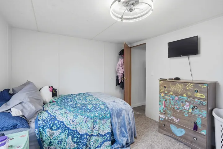 Bedroom with light carpet