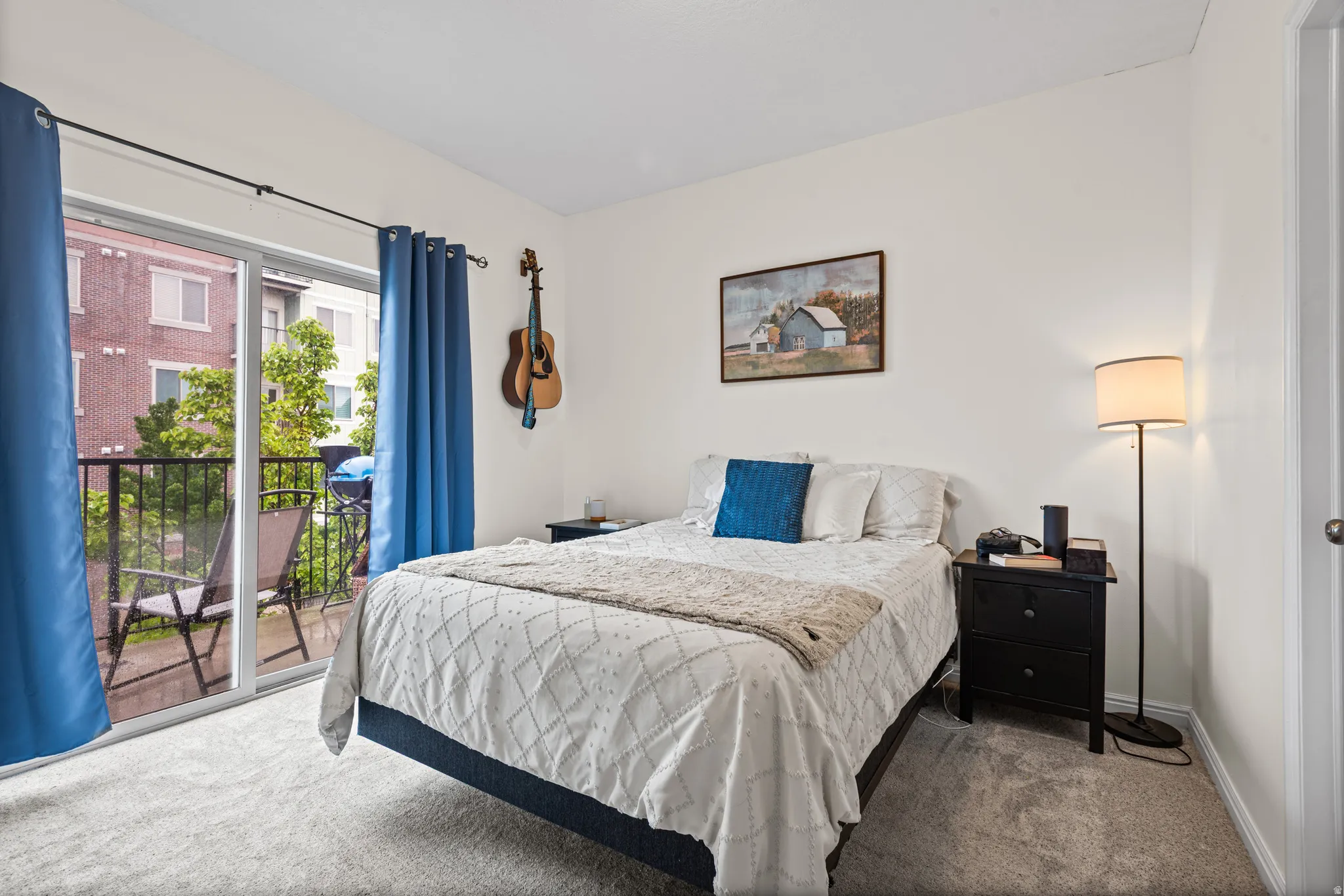 Carpeted bedroom featuring access to outside and baseboards