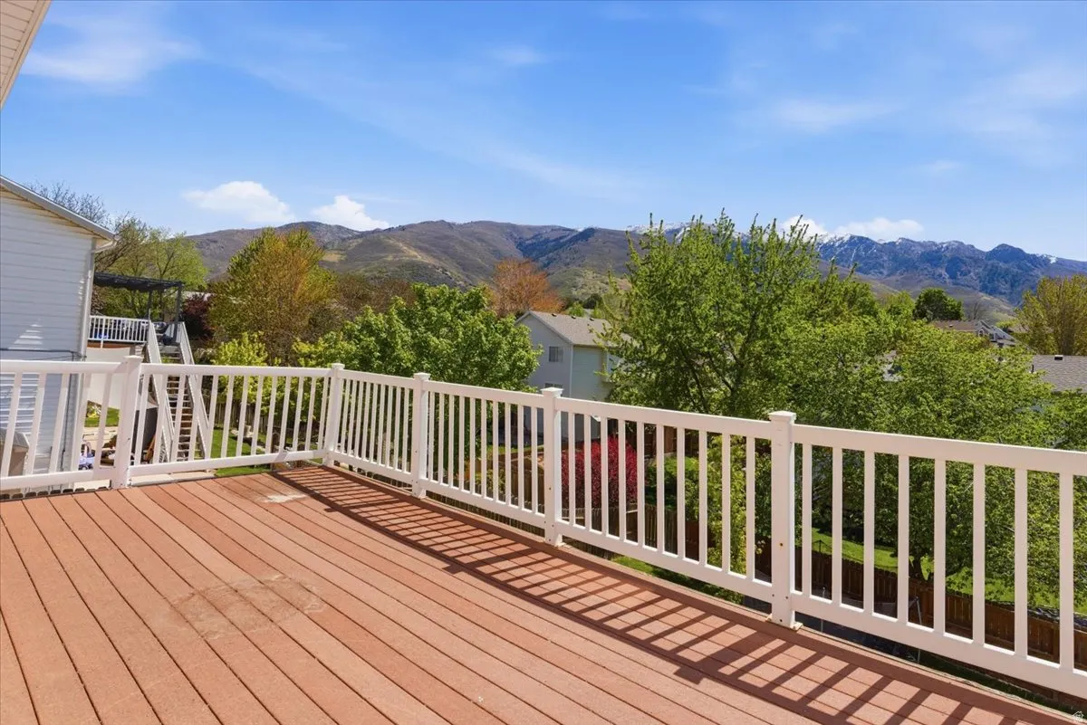 Wooden deck featuring a mountain view