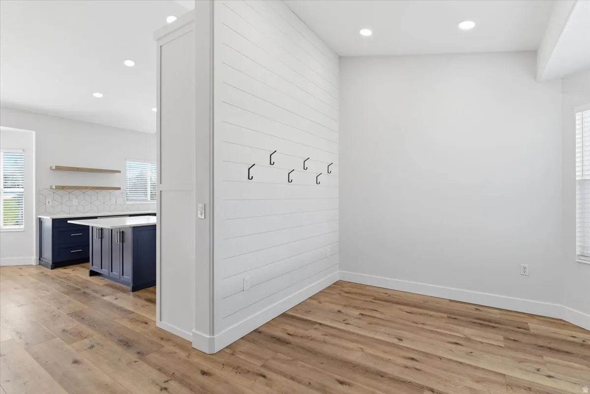 Mudroom with healthy amount of natural light, light wood-style floors, and recessed lighting