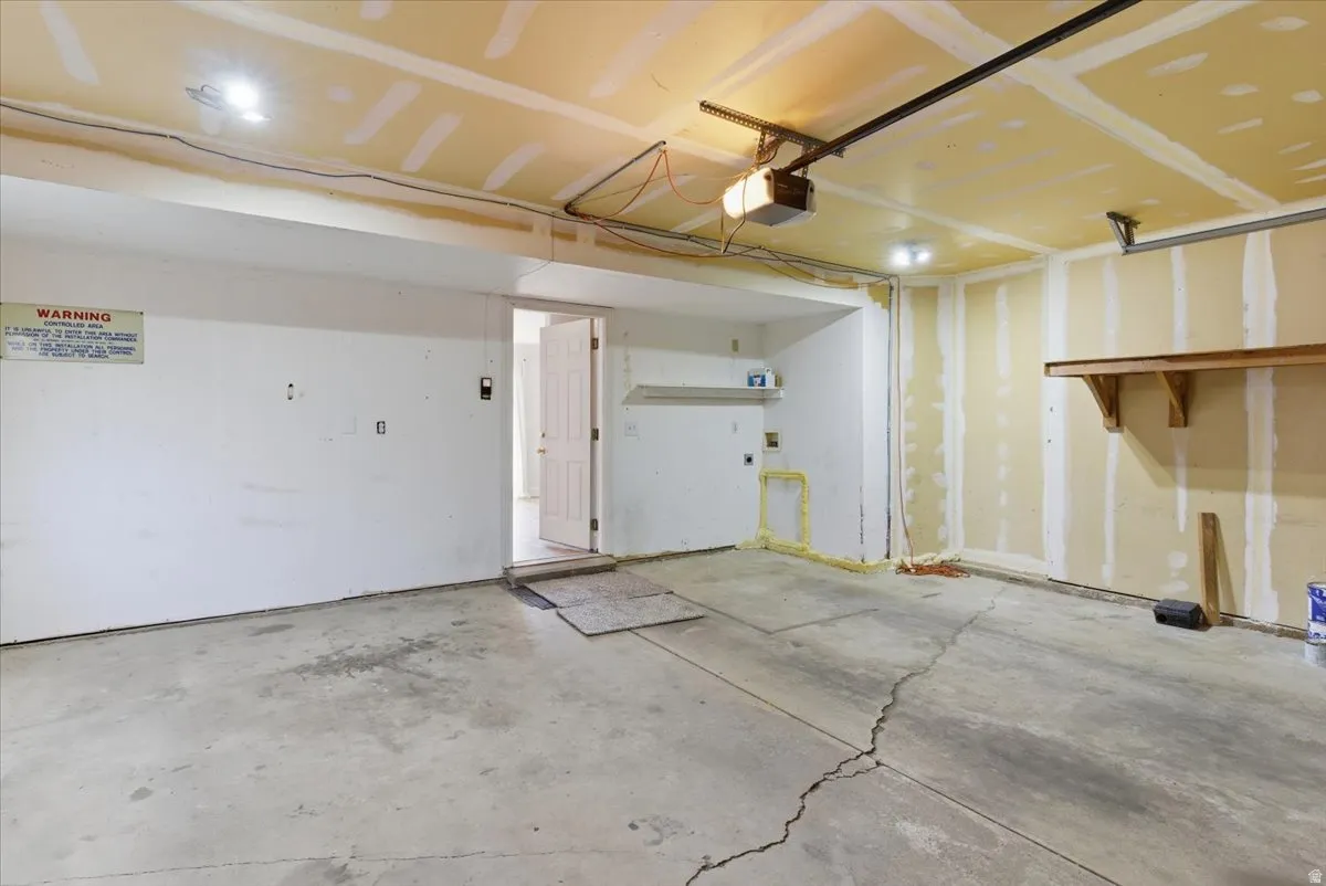 Garage featuring a garage door opener