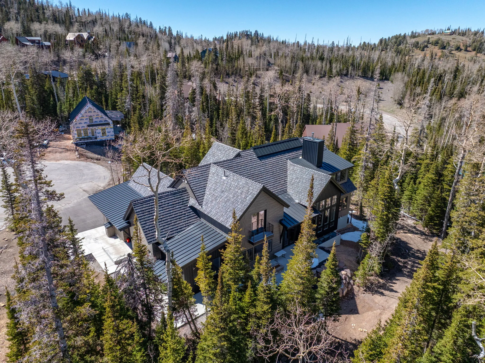 View from above of property with a heavily wooded area