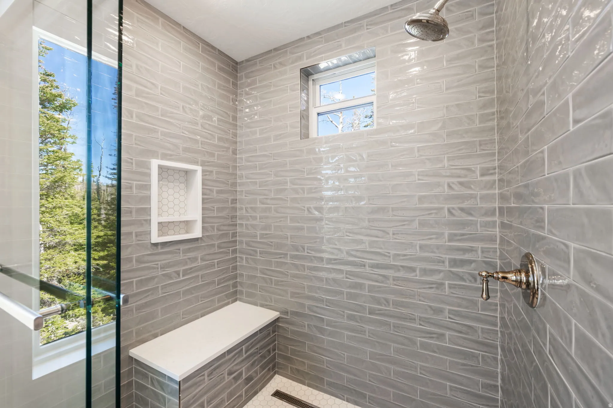 Bathroom featuring tiled shower