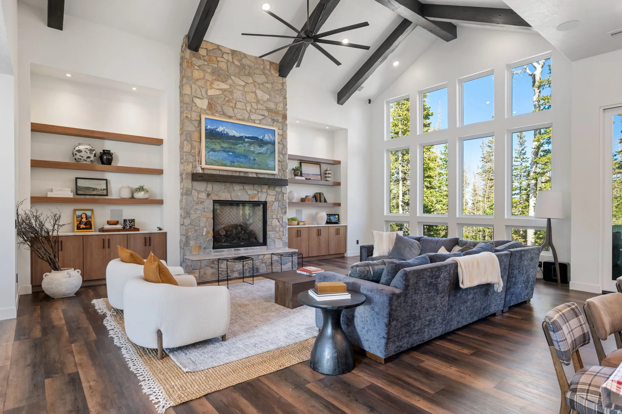 Living room with a fireplace, ceiling fan, dark wood finished floors, recessed lighting, and vaulted ceiling