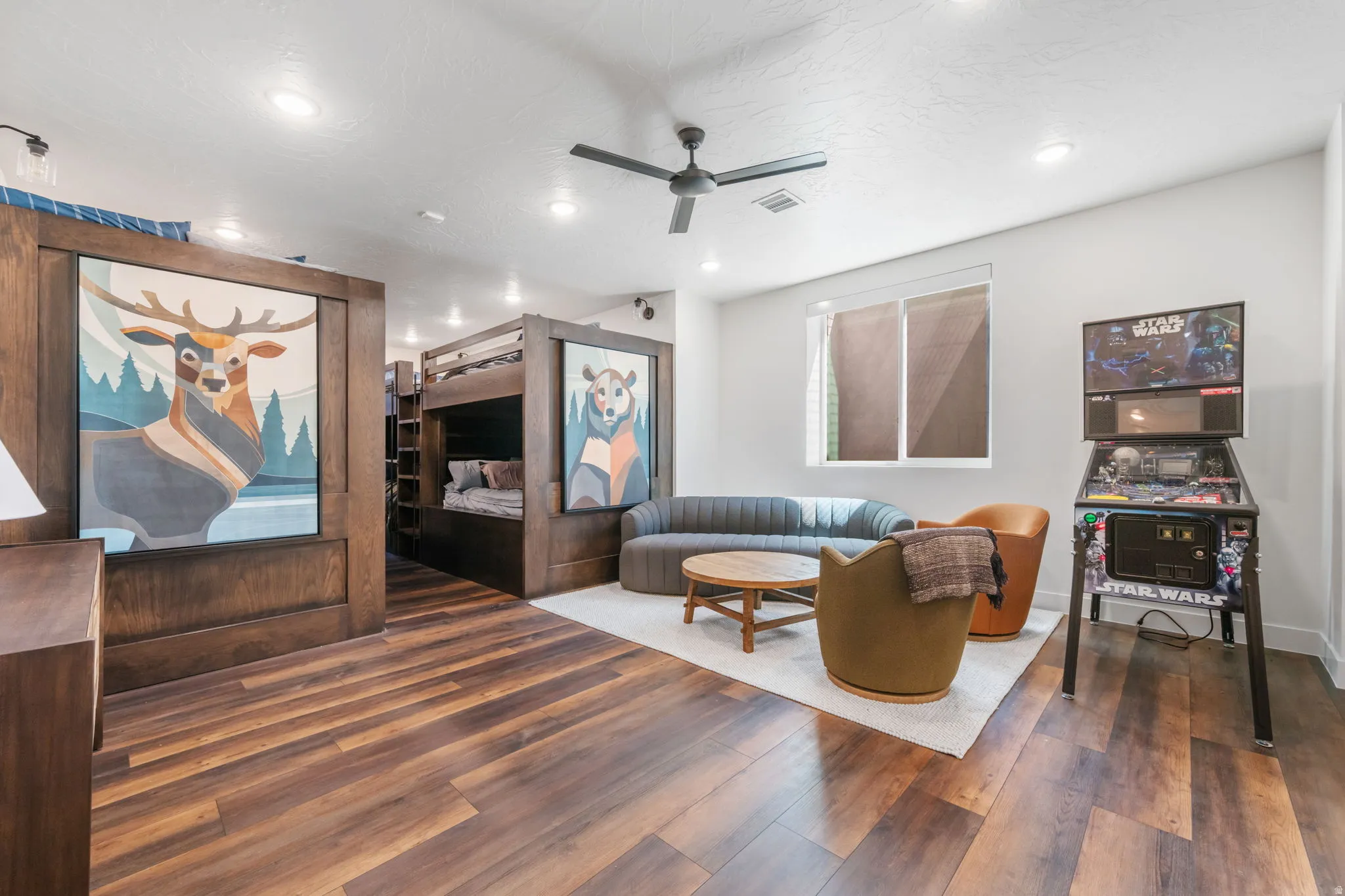 Living room with dark wood finished floors, ceiling fan, and recessed lighting
