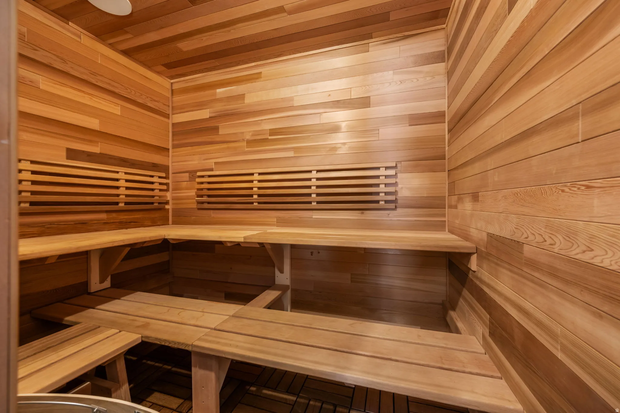 Sauna / steam room with wooden walls and wood ceiling